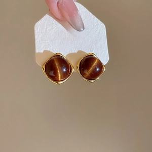 Detail of square vintage earrings with brown tiger eye stone in gold-plated S925 silver