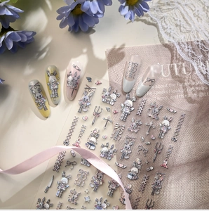 Detail of gothic dark Lolita nail stickers featuring rabbits, crosses and bows