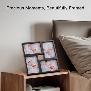 Detail of black collage photo frame for four images on a wooden bedside table