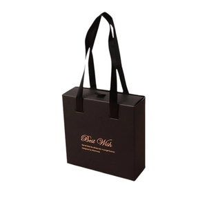 Elegant black leather-textured gift box with gold foil lettering and black ribbon handle