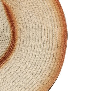 Close-up of natural straw Panama hat with brown gradient edge and spiral weave texture