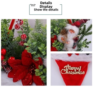 Detail of Christmas wreath with Santa Claus doll, red sequins flowers and pine needles