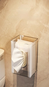 Wall-mounted tissue box detail showing transparent acrylic material with vertical stripes