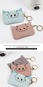 Close-up of cute pig-shaped PU leather card holders with gold keychains in soft pastel colors