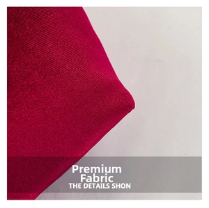 Close-up of premium red velvet knitted fabric texture with elegant pleated details