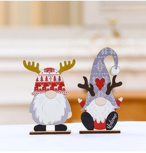Close-up of wooden Christmas gnomes with Welcome text on a cozy blurred background