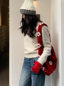 Winter plush tote bag with flower pattern paired with red knit gloves and casual outfit