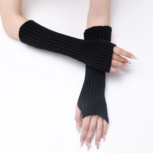 Detail of long black ribbed knit arm warmers with fingerless design for autumn and winter
