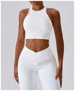 Close-up of white ribbed sports bra with halter neck and curved seam detailing