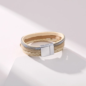 Detailed macro view of multilayer leather bracelet with starfish charm and magnetic clasp