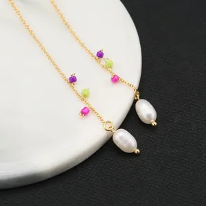 Elegant gold drop earrings with natural white pearls and multicolored beads on long chains
