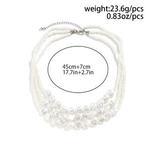 Detail of layered pearl necklace with baroque pearls, lobster clasp and size labels