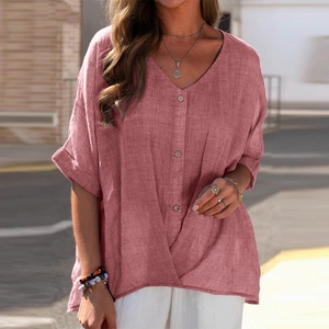 Detail of V-neckline and button placket on linen casual top in dusty rose color