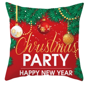 Detail of Christmas Party cushion cover with festive green pine and golden ball prints