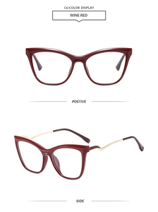 Detail view of wine red cat-eye frames with golden metal hinges and size engraving