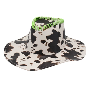 Cow print western cowboy hat with vibrant neon green rope detail on white background