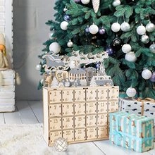 Close-up of wooden LED Christmas countdown advent calendar with 24 small drawers