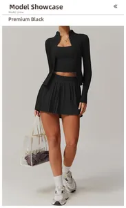 Close-up of premium black three-piece athletic set with jacket, vest, and pleated skirt