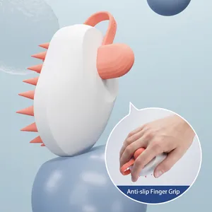Ergonomic silicone scalp massager brush with anti-slip finger grip in coral pink