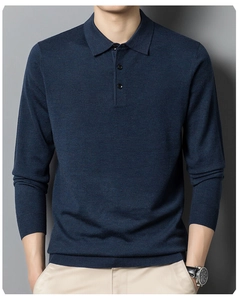 Detail of navy blue knitted long sleeve polo shirt showing fabric texture and button placket