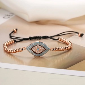 Elegant 18K rose gold plated beaded bracelet with blue zircon Evil Eye charm and black cord
