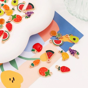 Detailed view of colorful fruit alloy enamel pendants for DIY jewelry making and crafts