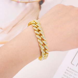 Detail view of 18k gold plated Cuban link bracelet with sparkling white rhinestones
