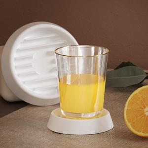 Detailed view of white minimalist striped resin tray and cylindrical cup coaster