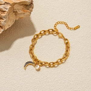 Detail of 18K gold stainless steel bracelet with black enamel moon and zircon charms
