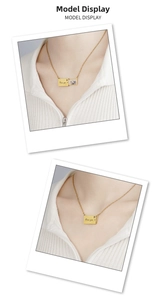 Detailed view of golden envelope locket necklace with I love you engraving and photo insert