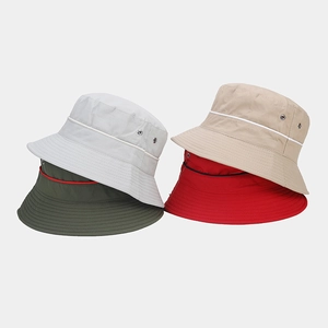 Detail of wide brim bucket hats with metal vents and stripe trim in multi-color options