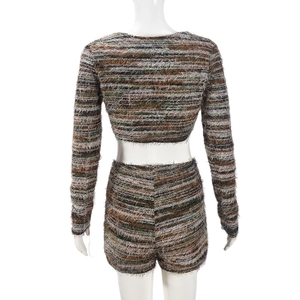 Detail of fuzzy knitted two-piece set with brown stripes and open back tie design