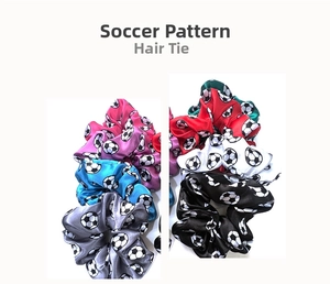 Close-up of satin soccer print scrunchies in multiple colors with elastic fabric texture
