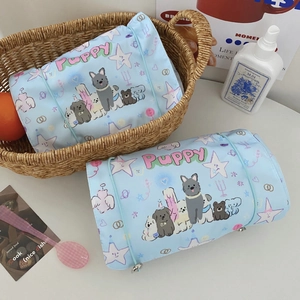 Light blue roll-up toiletry bag with cute puppy print and elastic closure strap