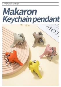 Detailed macro view of cute leather elephant keychains in five vibrant macaron colors