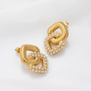 Detail of 18K gold-plated interlocking earrings with cubic zirconia and white pearl