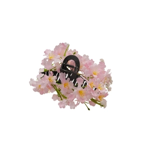 Elegant spring floral hair clip with pink silk flower clusters on black base
