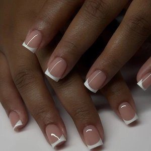 Classic French tip press-on nails with pink base and white square tips for a natural look