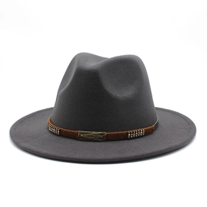 Detail of dark grey wool fedora hat with brown band and vintage metallic buckle