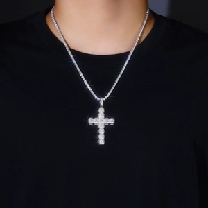 Close-up of hip hop silver cross pendant with sparkling moissanite on tennis chain
