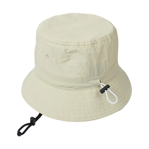 Detail view of the beige bucket hat with adjustable toggle drawstrings and chin strap