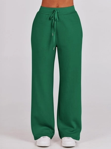 Deep forest green high-waisted wide-leg sweatpants with drawstring detail and soft texture