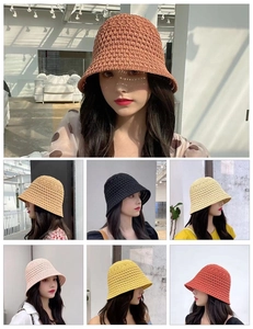 Multiple colors of crochet knit bucket hats including beige, yellow and caramel shades