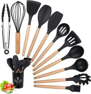 Detail of 12-piece black silicone cooking utensils with wooden handles and storage bucket
