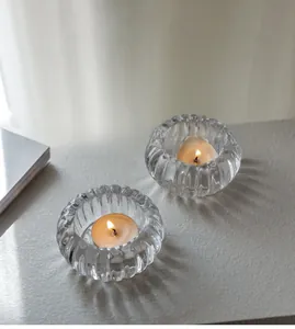 Détail des bougeoirs en verre côtelé citrouille avec bougies chauffe-plat incluses