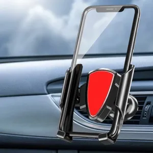 Detailed view of gravity phone holder with red shield design on car air vent outlet