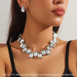 Close-up of model wearing rectangular crystal necklace and stud earrings set