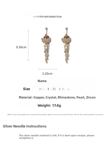 Detail showing dimensions of long crystal bow tassel earrings with faux pearl drops