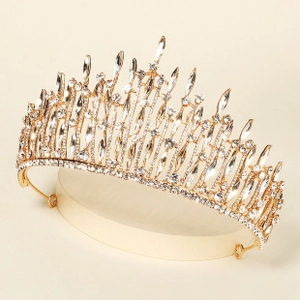 Detailed close-up of a vintage bridal tiara with gold alloy and marquise rhinestones
