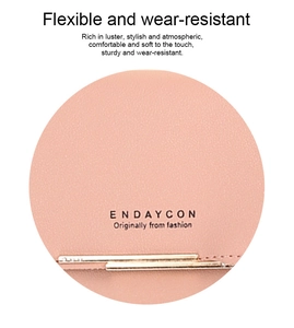 Detail of pink lychee leather texture with gold hardware on a crossbody phone bag